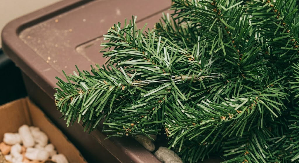 Crushed and flattened PVC Christmas tree branches after a year in storage